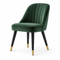 Chaise en velours vert avec pieds en métal noir et doré